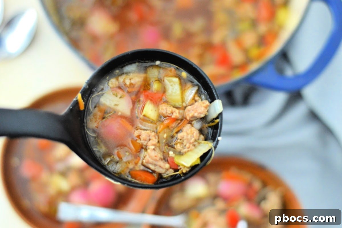 A finished bowl of Keto Sausage and Veggie Soup, ready to be served