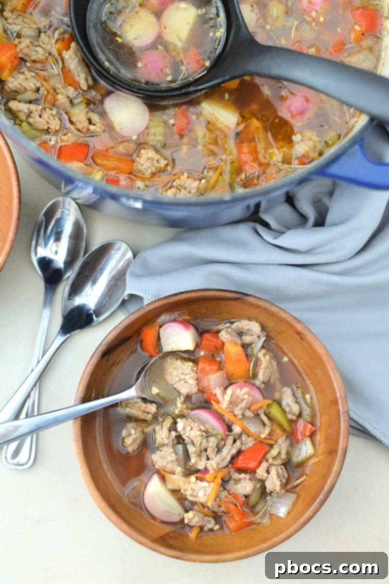 Ingredients for Keto Sausage and Veggie Soup laid out on a cutting board