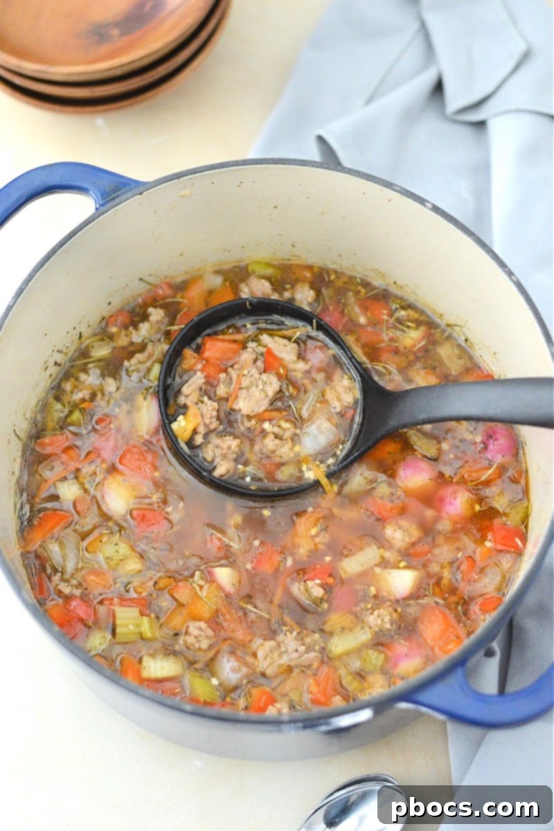 Containers of Keto Sausage and Veggie Soup for meal prepping