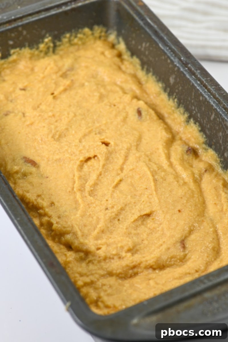 Keto Pumpkin Pecan Gingerbread Loaf - Pouring Batter into Pan