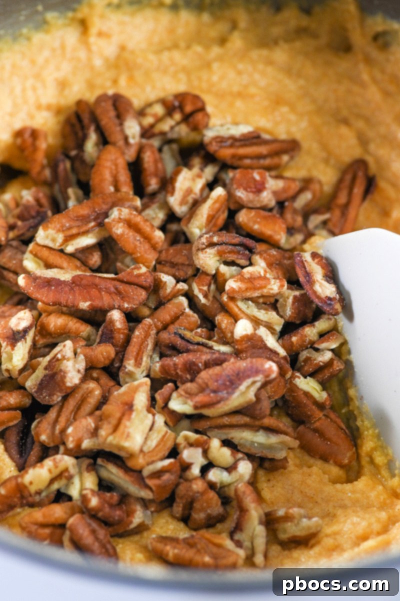 Keto Pumpkin Pecan Gingerbread Loaf - Folding in Pecans