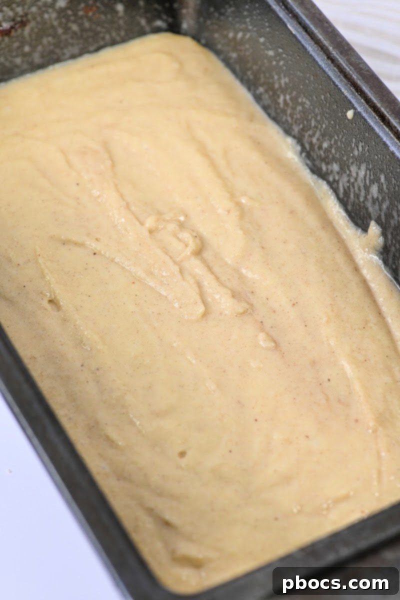 Sugar Free Eggnog Quick Bread with Creamy Glaze 9 Raw bread batter in a loaf pan