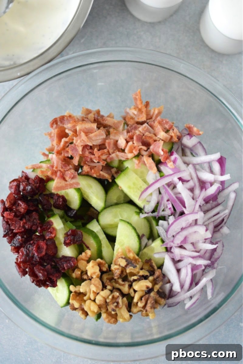 Keto Creamy Cucumber Salad With Cranberries - Combining Ingredients