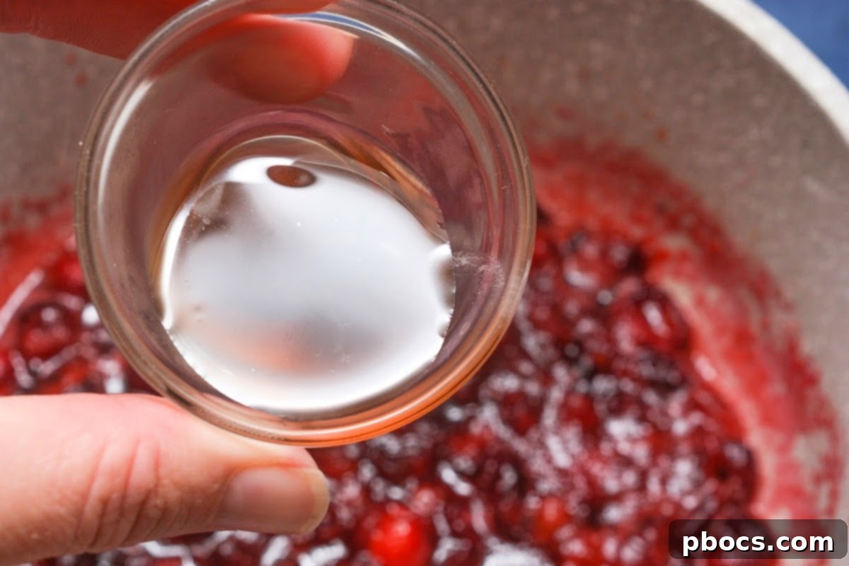 Adding vanilla to the cranberries
