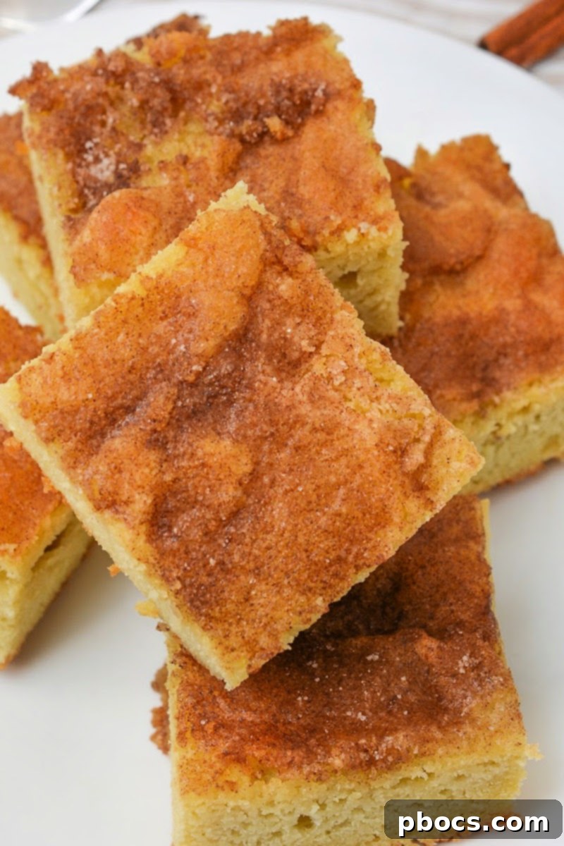 Baked Keto Snickerdoodle Bars cooling in the baking dish after being removed from the oven.