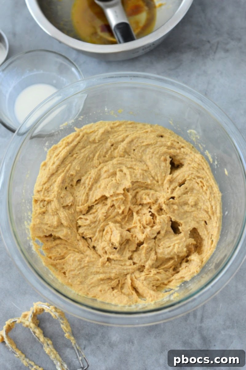 Spiced Keto Gingerbread Muffins with Creamy Icing 11 Raw Gingerbread Muffin Batter in a bowl
