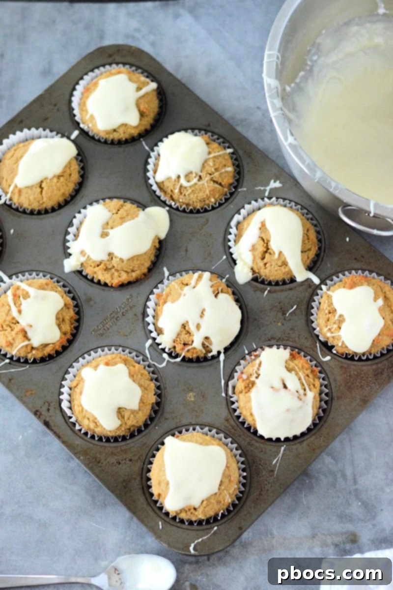 Spiced Keto Gingerbread Muffins with Creamy Icing 15 Finished Keto Gingerbread Muffins with Eggnog Icing Ready to Eat