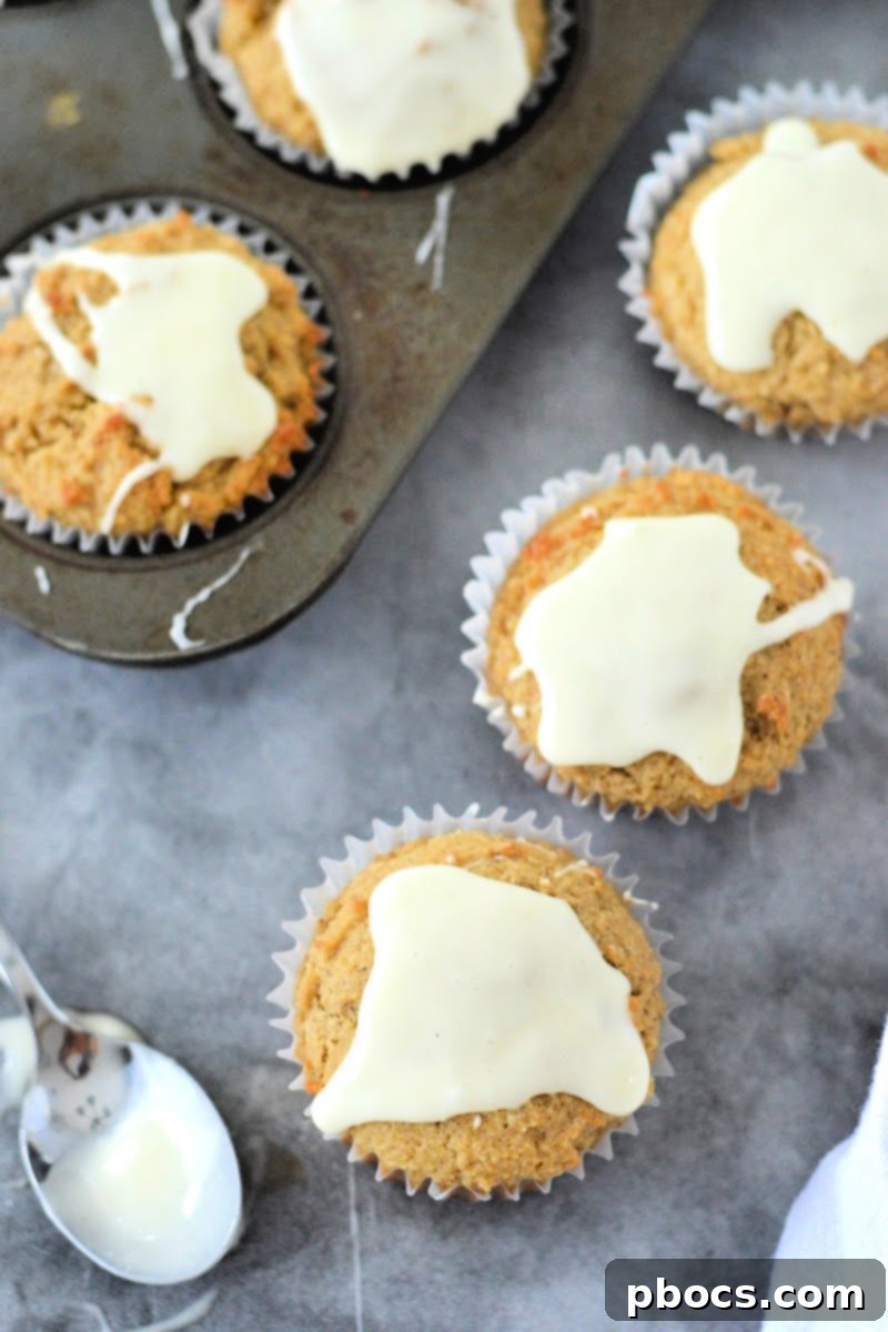 Spiced Keto Gingerbread Muffins with Creamy Icing 3 Warm Keto Gingerbread Muffins Ready for Glaze