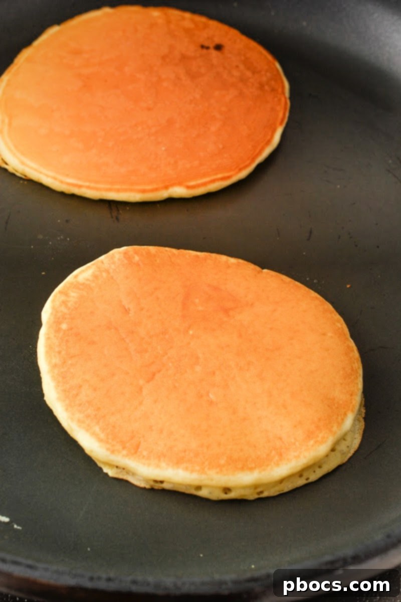 Cooking Keto Pancakes on a griddle