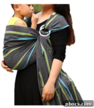 My Babywearing Love Story and Top Carriers 5 Mother using a Vlokup Baby Sling Carrier during a walk.