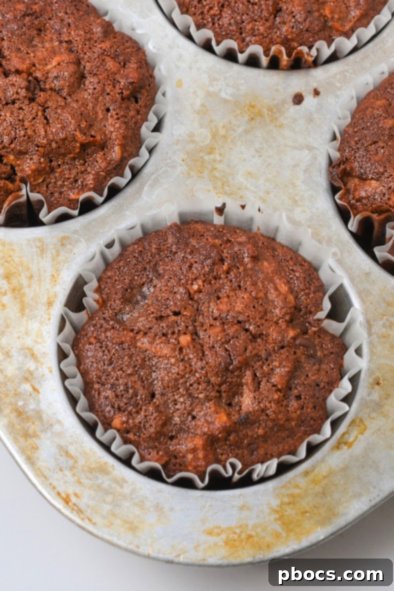 Keto Chocolate Pecan Pie Muffins baking in the oven