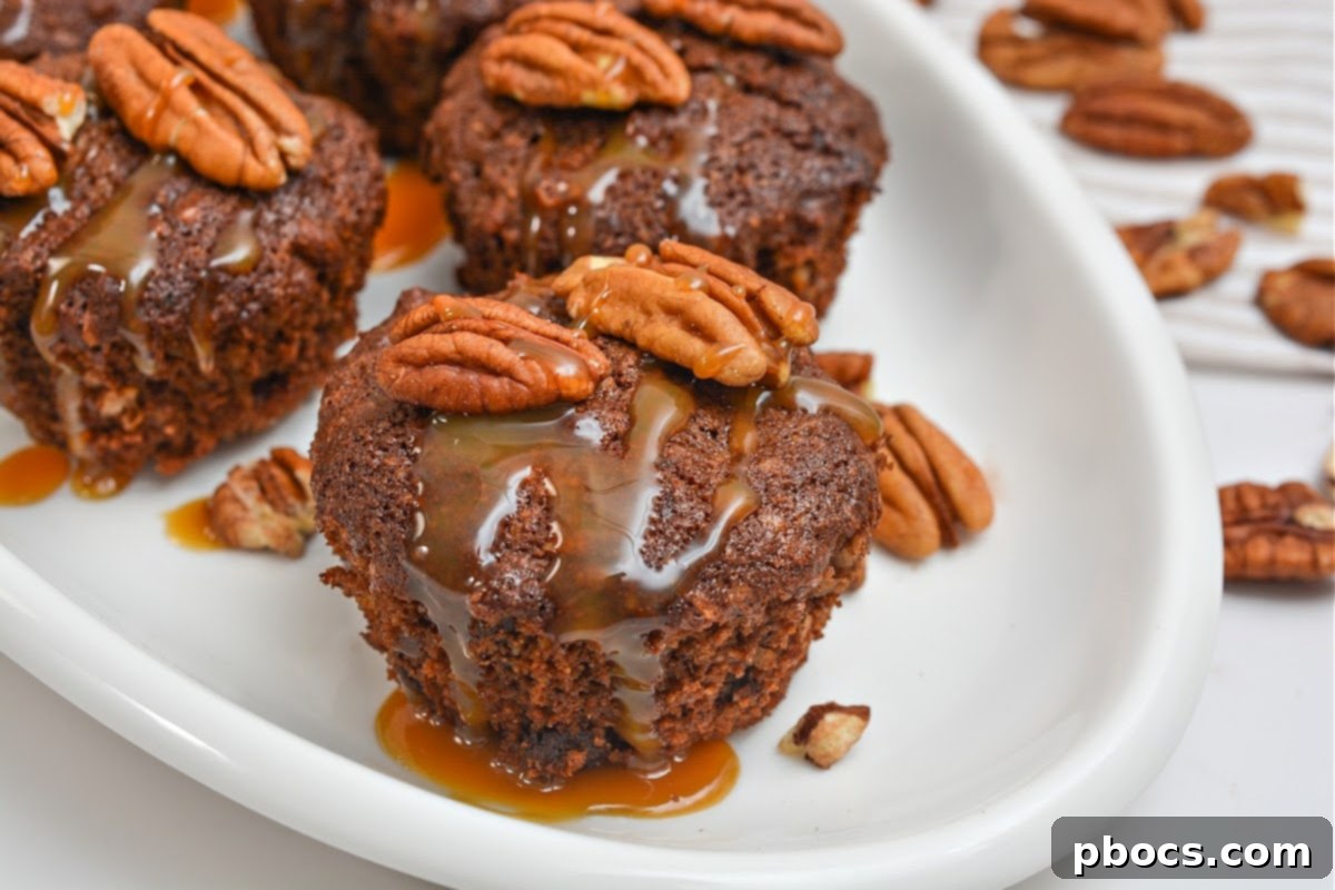 A plate of Keto Chocolate Pecan Pie Muffins with caramel drizzle