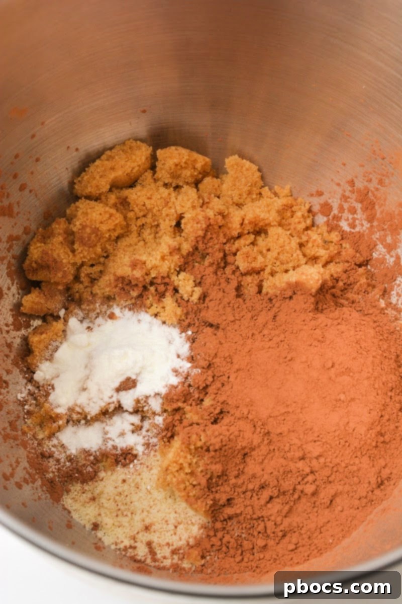Mixing the dry ingredients together for keto chocolate pecan pie muffins