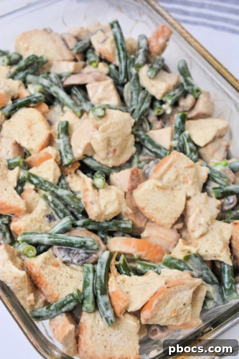 Spreading the casserole mixture into a baking dish
