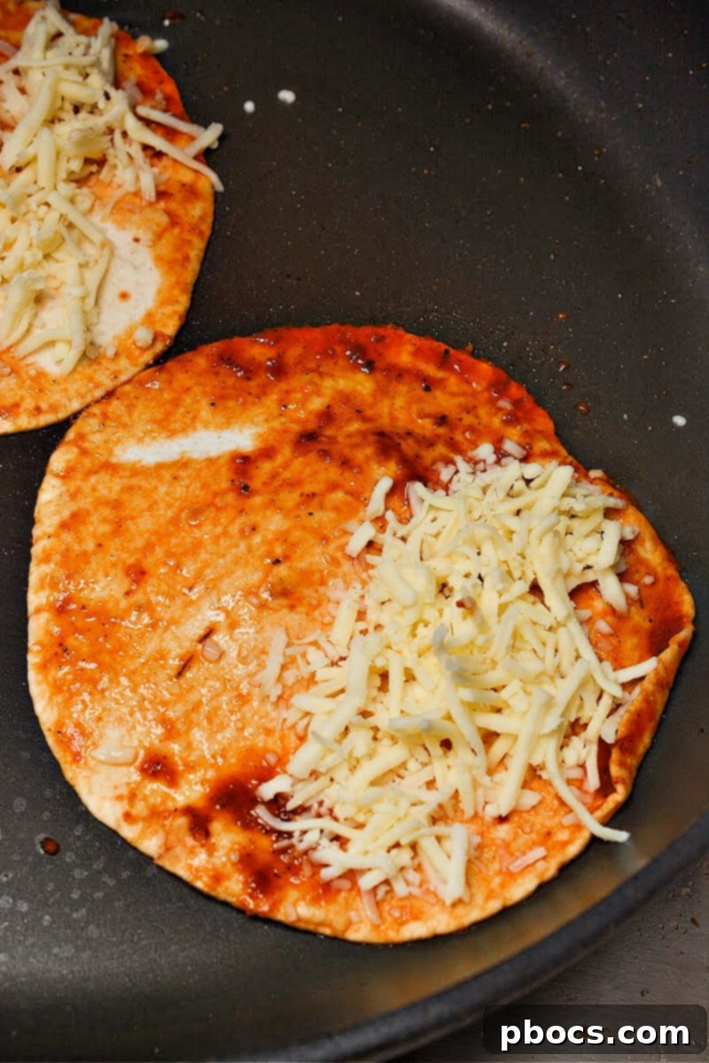 Savory Keto Birria Beef Tacos 19 Dipping Tortilla in Consommé