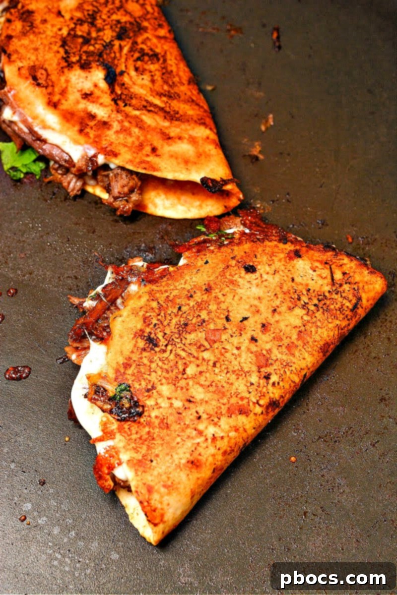 Savory Keto Birria Beef Tacos 21 Folding and Frying Birria Tacos