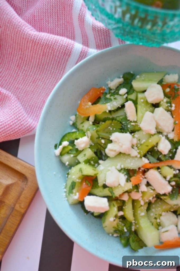 Crisp Cucumber Zesty Feta Jalapeno Kick Salad 5 Close-up of the finished cucumber, jalapeño, and feta salad in a bowl, showcasing its fresh ingredients and vibrant colors.