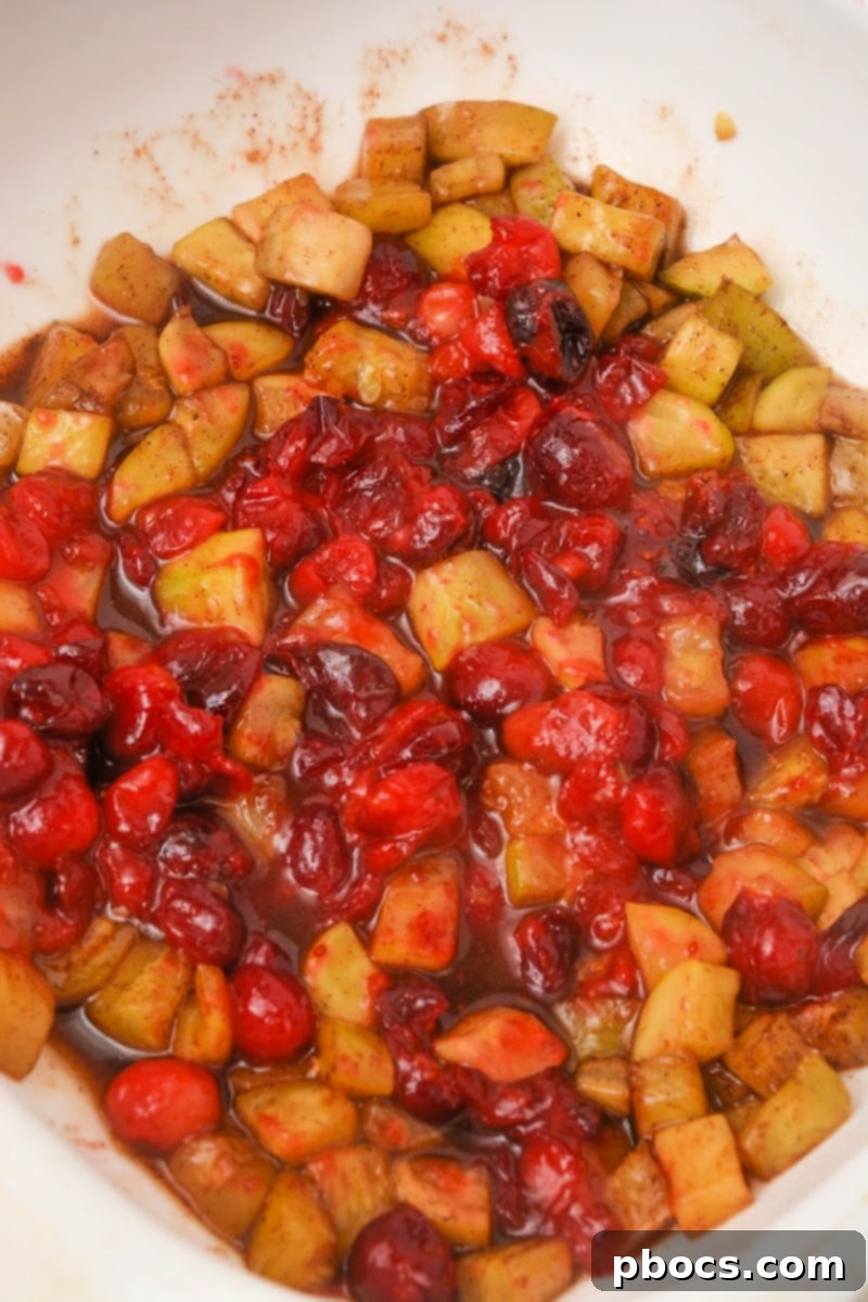 Yuletide Low-Carb Cranberry Apple Dump Cake 11 Mixing cranberries and zucchini with sweetener mixture