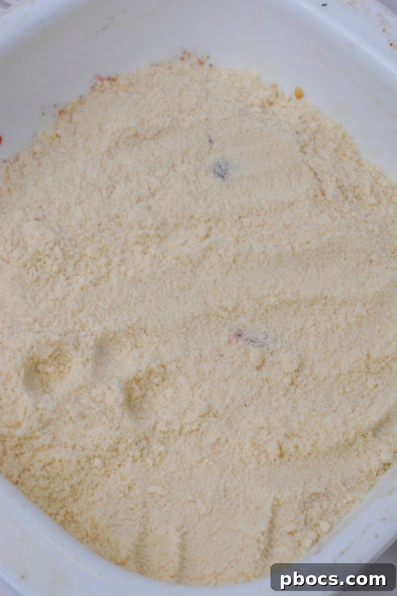 Yuletide Low-Carb Cranberry Apple Dump Cake 12 Adding almond flour mixture to the bottom of the cake pan