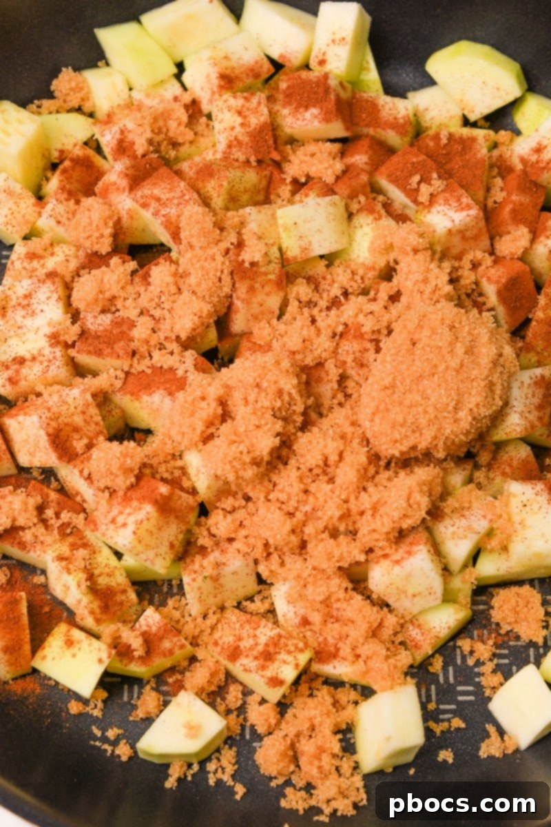 Yuletide Low-Carb Cranberry Apple Dump Cake 9 Adding Swerve brown sugar mixture to the zucchini