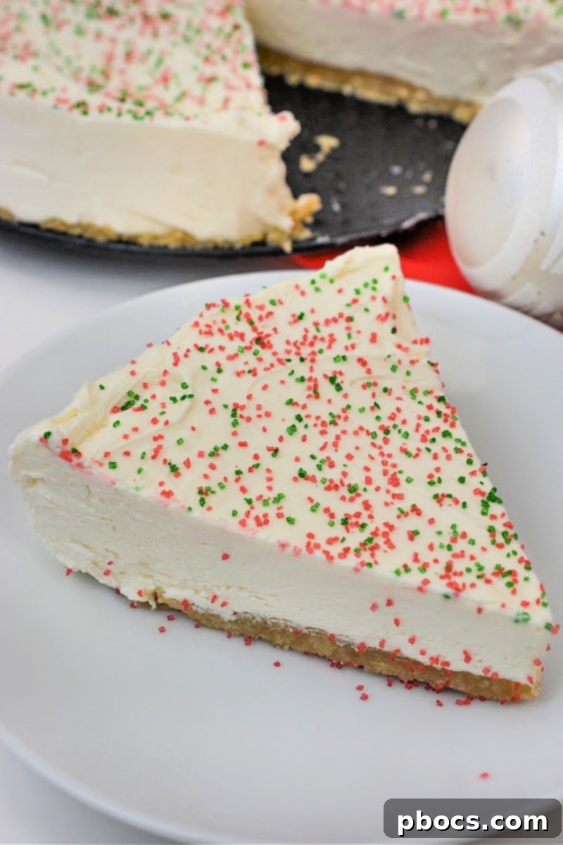 Low Carb Christmas Cookie Cheesecake adorned with festive sprinkles