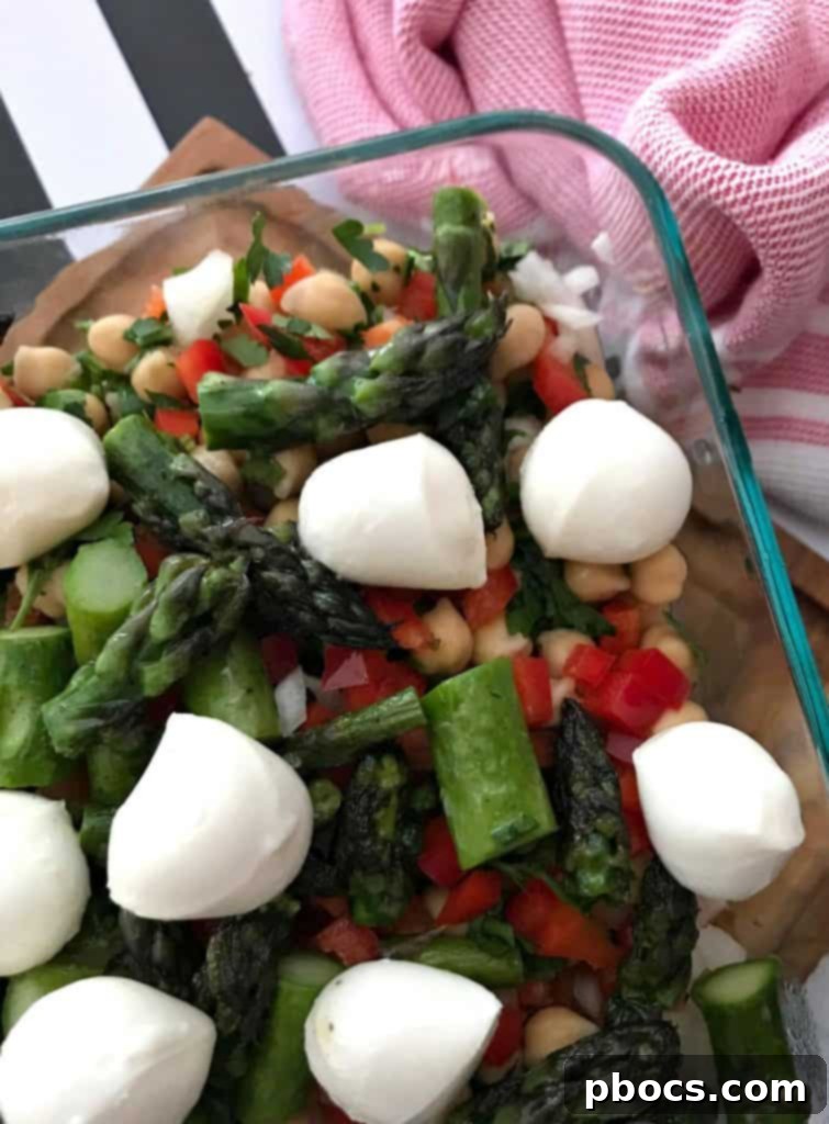 The final Chickpeas Asparagus and Mozzarella Cheese Salad topped with mozzarella.