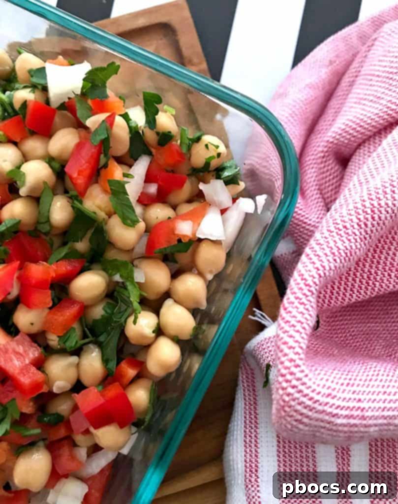 Chopped red pepper, cilantro, and onion in a bowl.