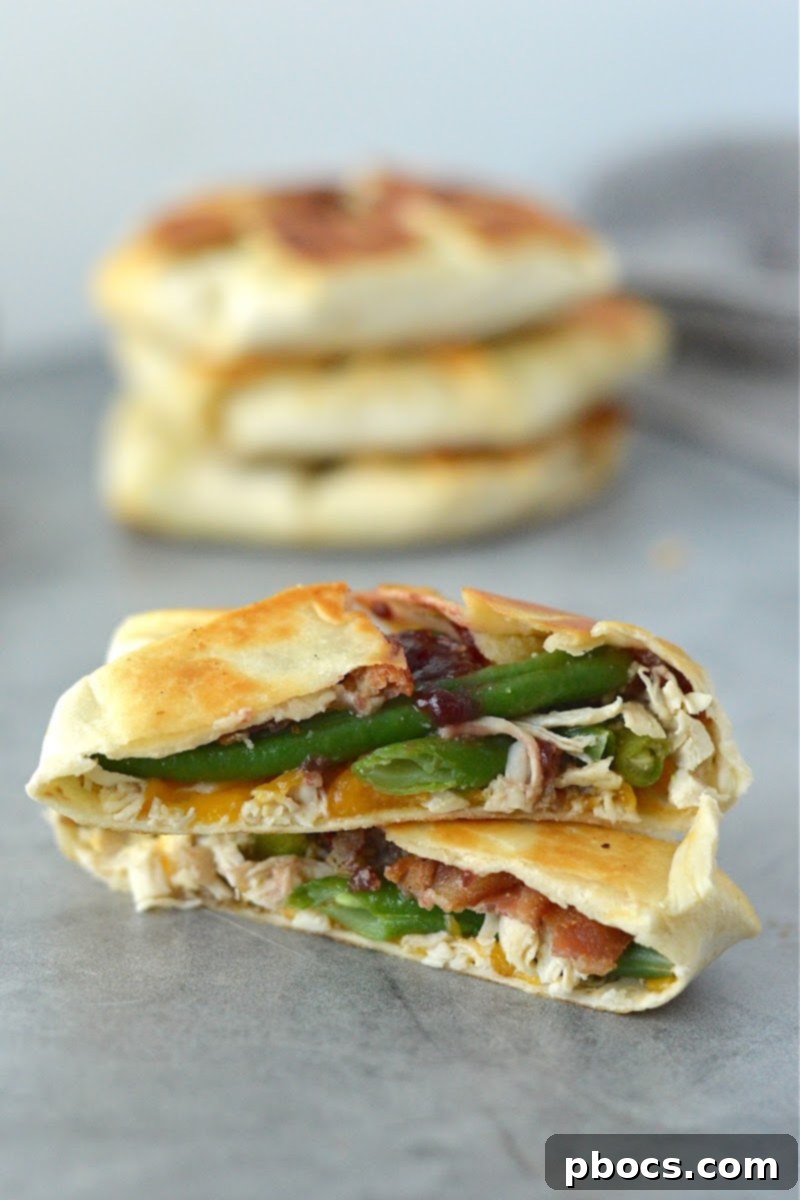 Festive Keto Crunchwrap Delight 4 Close-up of a Low-Carb Holiday Crunchwrap, highlighting the colorful cranberry and green bean filling.