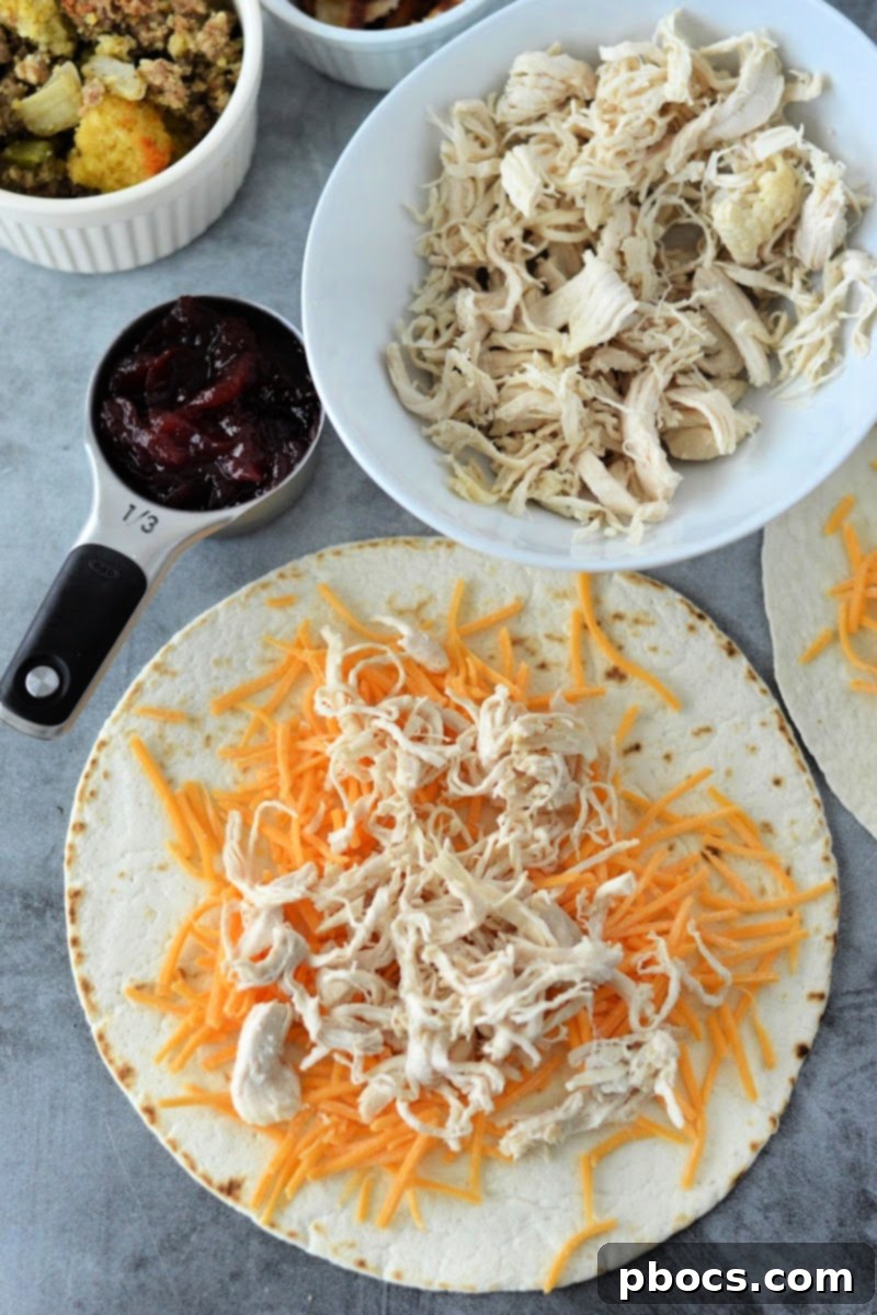 Festive Keto Crunchwrap Delight 10 Adding shredded turkey or chicken on top of the cheese layer in the tortilla.