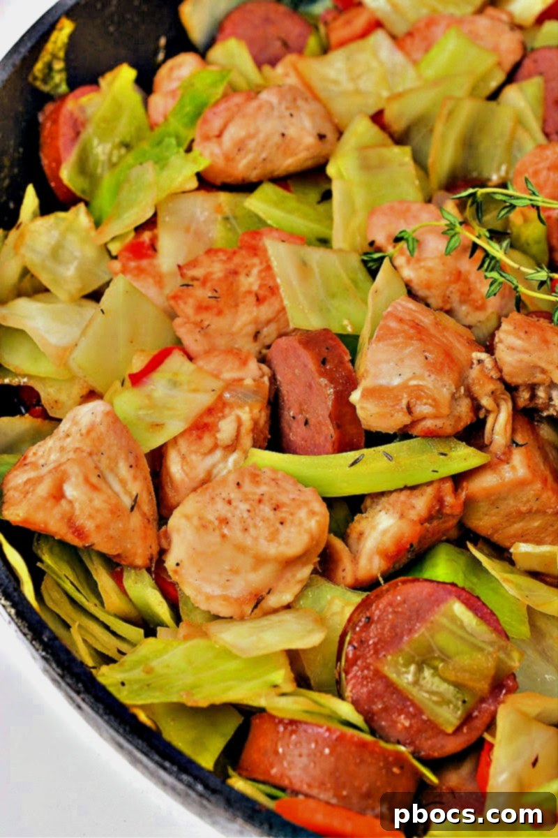 Sticky Honey Garlic Keto Skillet Chicken and Sausage 4 Close-up of seared chicken pieces in a skillet for Keto Skillet Honey Garlic Sausage and Chicken