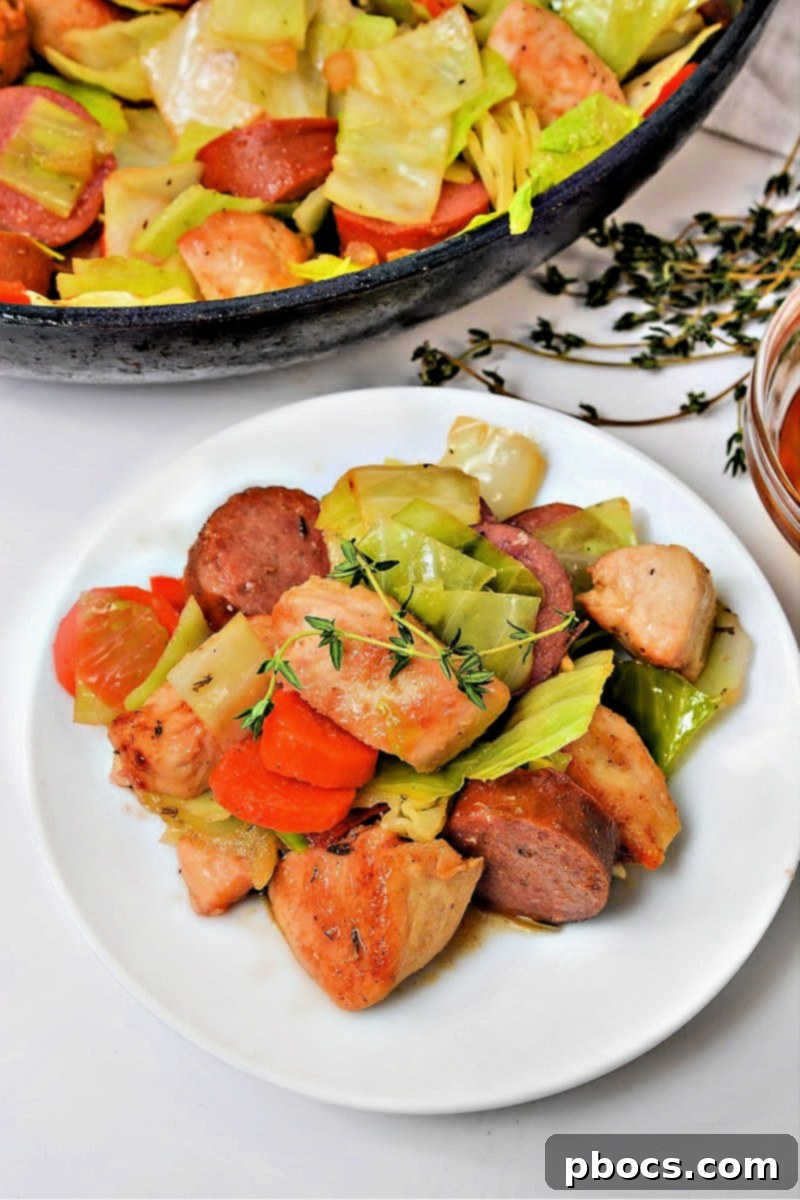 Sticky Honey Garlic Keto Skillet Chicken and Sausage 6 Keto Skillet Honey Garlic Sausage and Chicken in a bowl with a fork