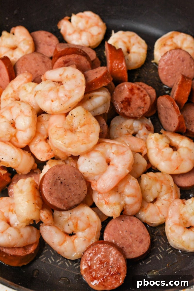 Sweet and Sticky Low-Carb Honey Garlic Shrimp and Sausage 9 Cooking shrimp and sausage