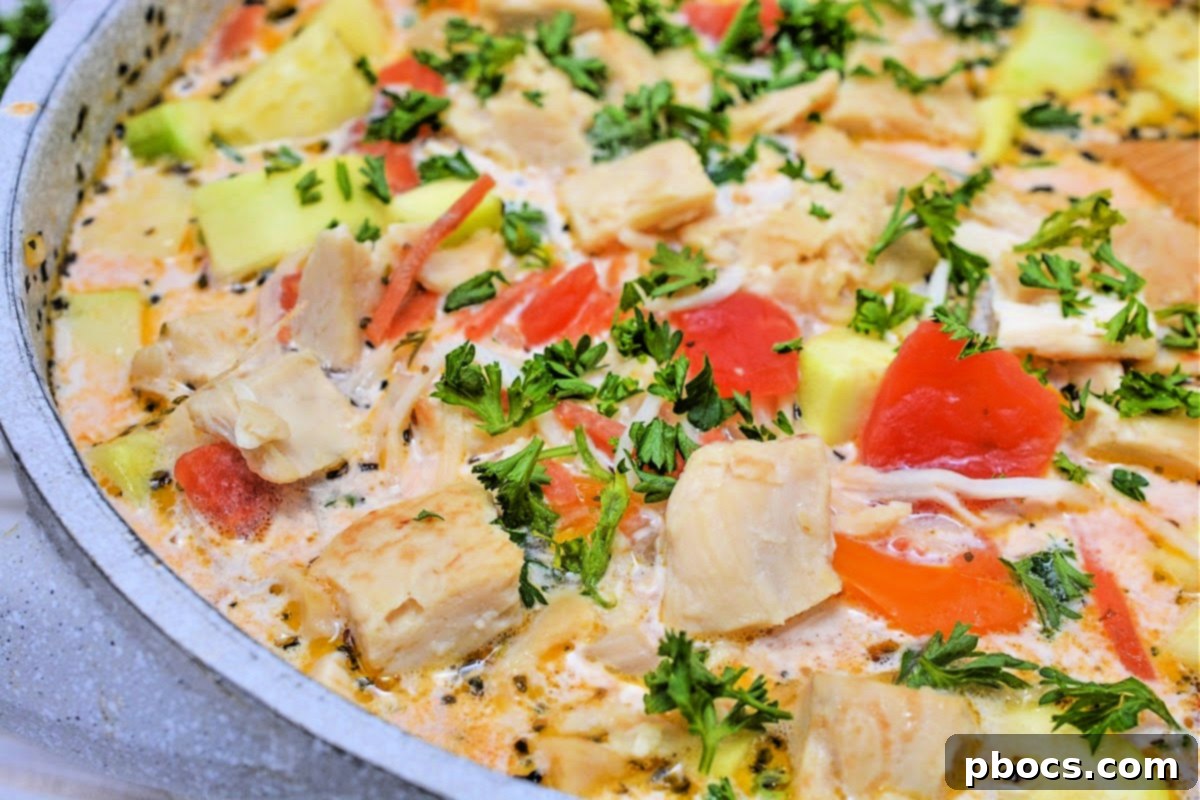 Low-Carb Italian Zucchini Bliss 3 Rich and creamy low-carb zucchini soup with colorful vegetables.