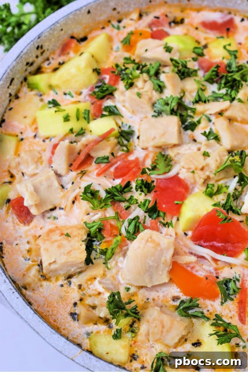 Low-Carb Italian Zucchini Bliss 5 A ladle serving creamy low-carb Italian zucchini soup into a bowl.