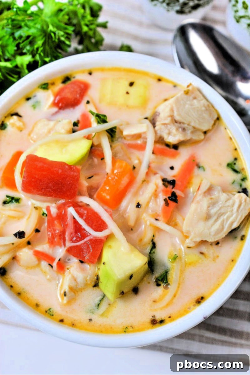 Low-Carb Italian Zucchini Bliss 7 A bowl of creamy Italian zucchini soup served with a side of fresh bread (keto-friendly alternative).