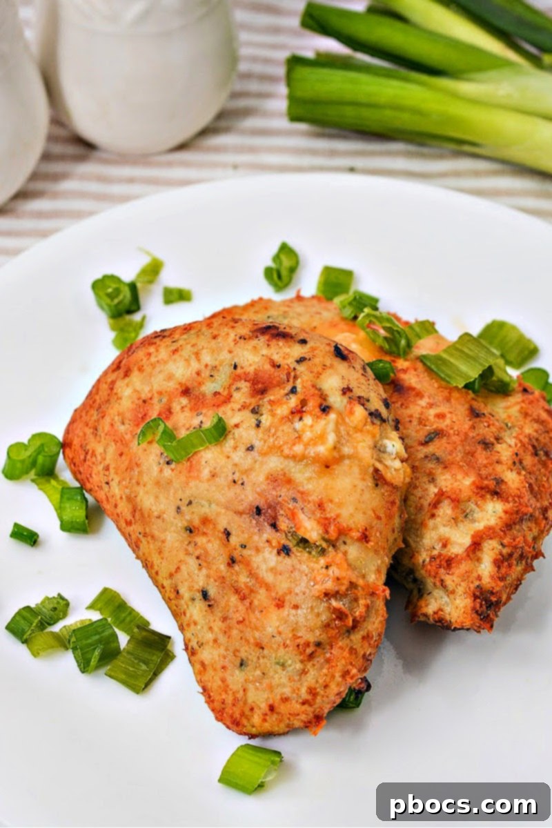 Keto Cheesy Ranch Chicken Pockets 2 Delicious Keto Crack Chicken Hot Pockets, golden brown and cheesy, ready to be enjoyed as a low-carb meal