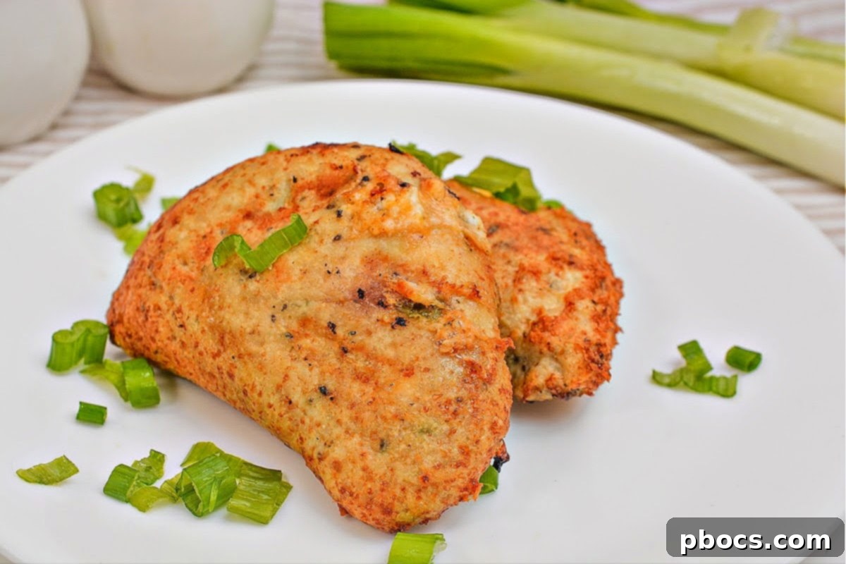 Keto Cheesy Ranch Chicken Pockets 5 A close-up shot of a freshly air-fried Keto Crack Chicken Hot Pocket, showcasing its golden-brown exterior and tempting texture