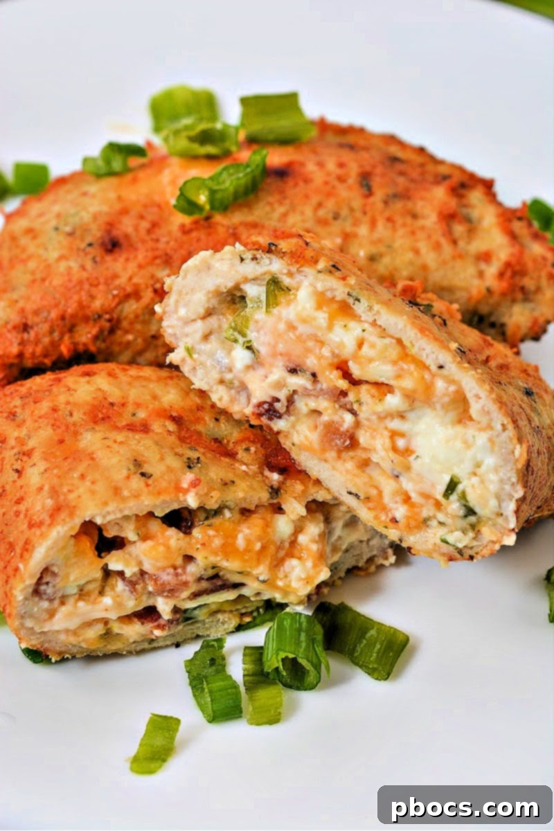 Keto Cheesy Ranch Chicken Pockets 6 A serving of homemade Keto Crack Chicken Hot Pockets displayed on a plate, highlighting their appetizing appearance