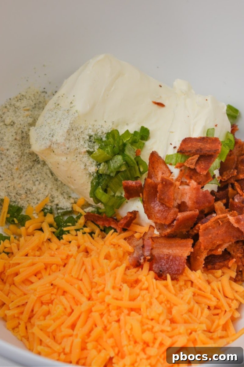 Keto Cheesy Ranch Chicken Pockets 10 Mixing the creamy crack chicken filling ingredients: cream cheese, ranch seasoning, green onions, cheddar cheese, and bacon