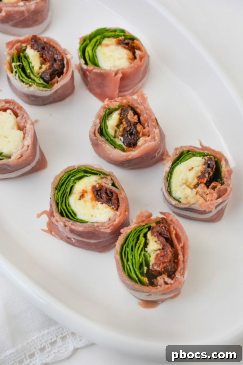 Slicing the chilled Keto Italian Sushi rolls into individual pieces