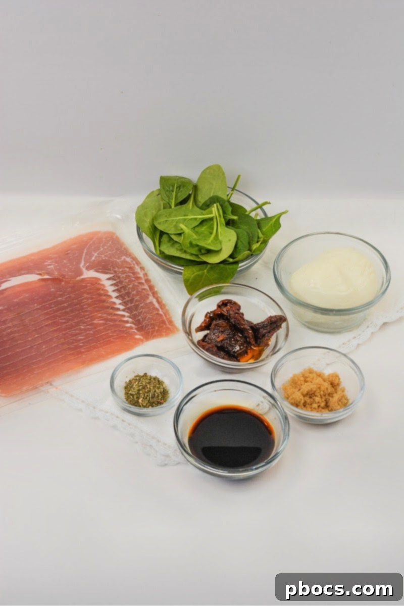 Fresh ingredients for Keto Italian Sushi including prosciutto, mozzarella, and spinach