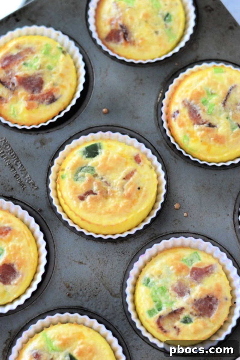 Keto Jalapeno Popper Egg Bites baking in a muffin tin.