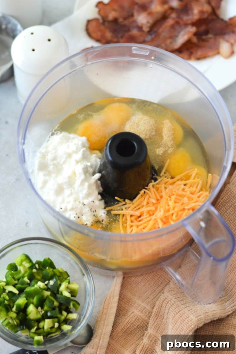 Food processor blending egg mixture for Keto Jalapeno Popper Egg Bites.