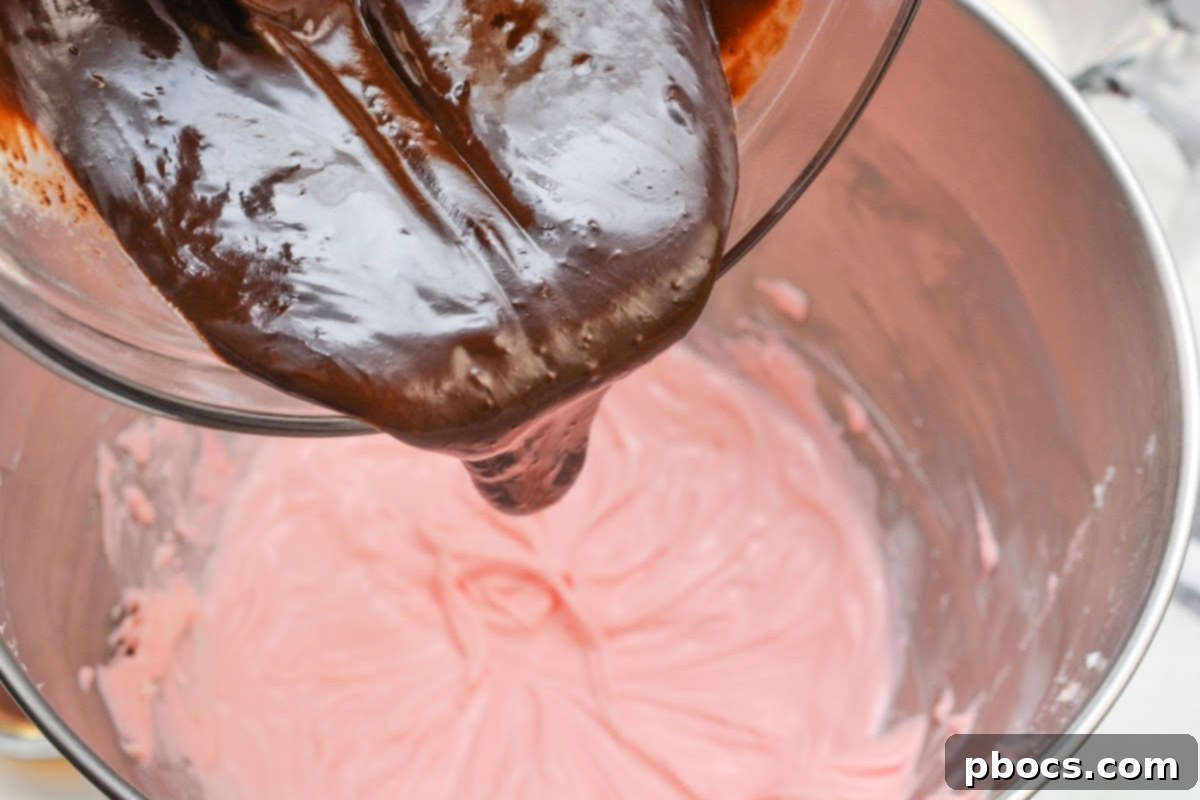 Adding chocolate to the cream cheese mixture