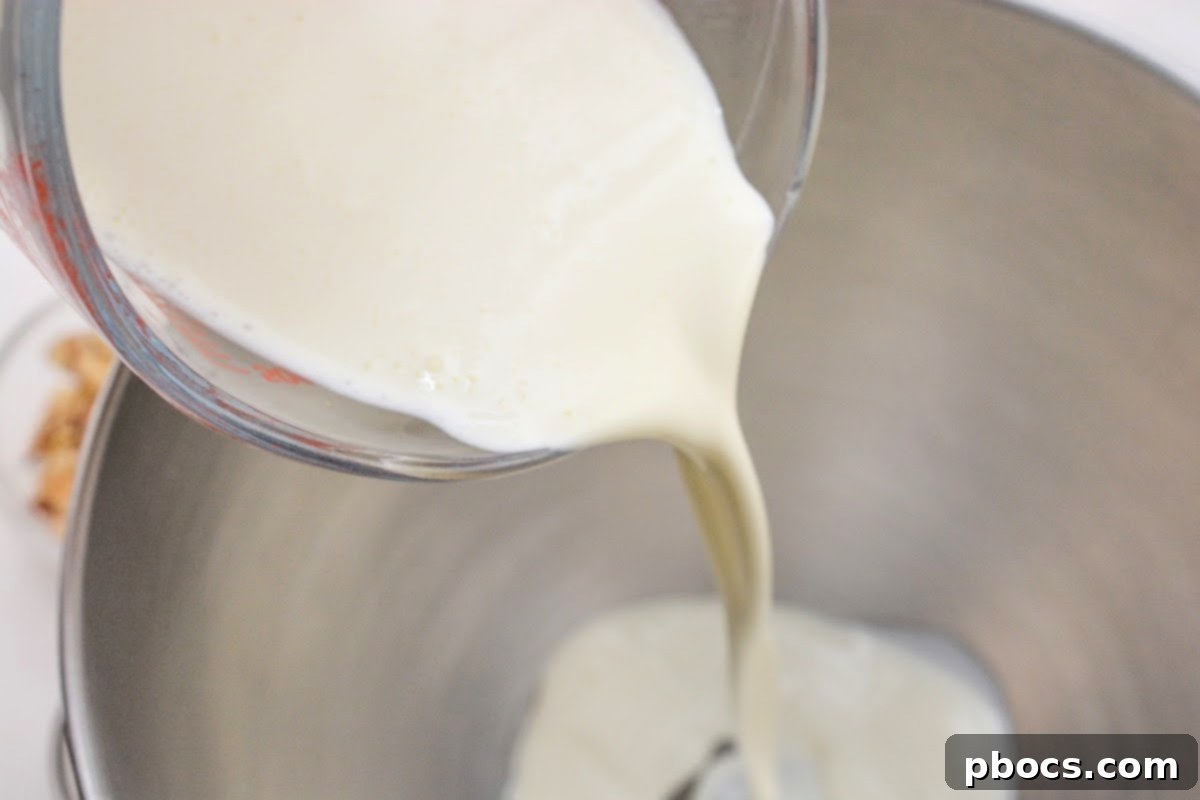 Adding heavy whipping cream to a bowl