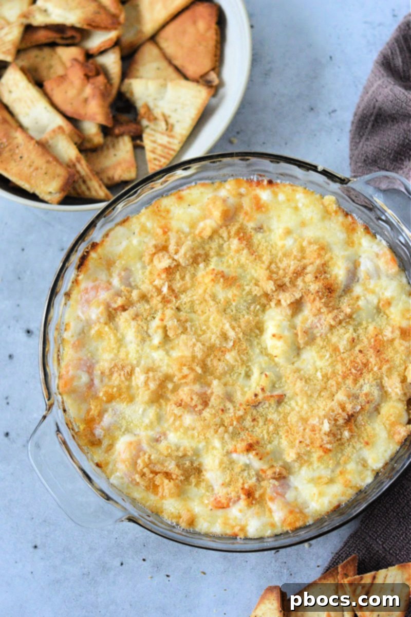 Close-up of baked Keto Shrimp Scampi Dip with golden-brown topping