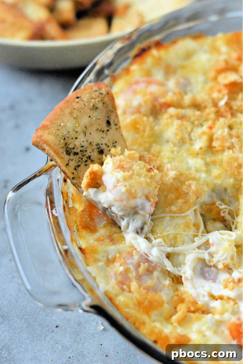 Mixing bowl with cream cheese, mozzarella, sour cream, and mayonnaise for the dip