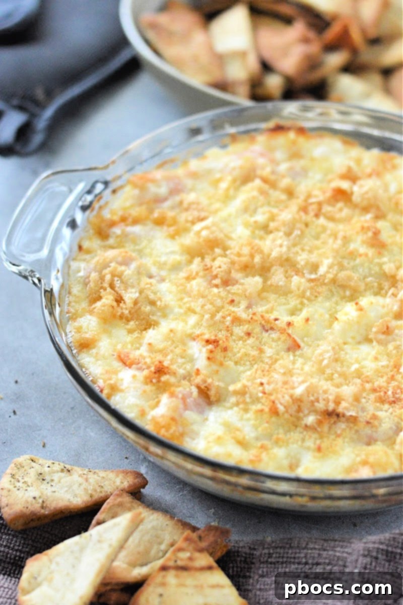 Baked Keto Shrimp Scampi Dip garnished with fresh parsley