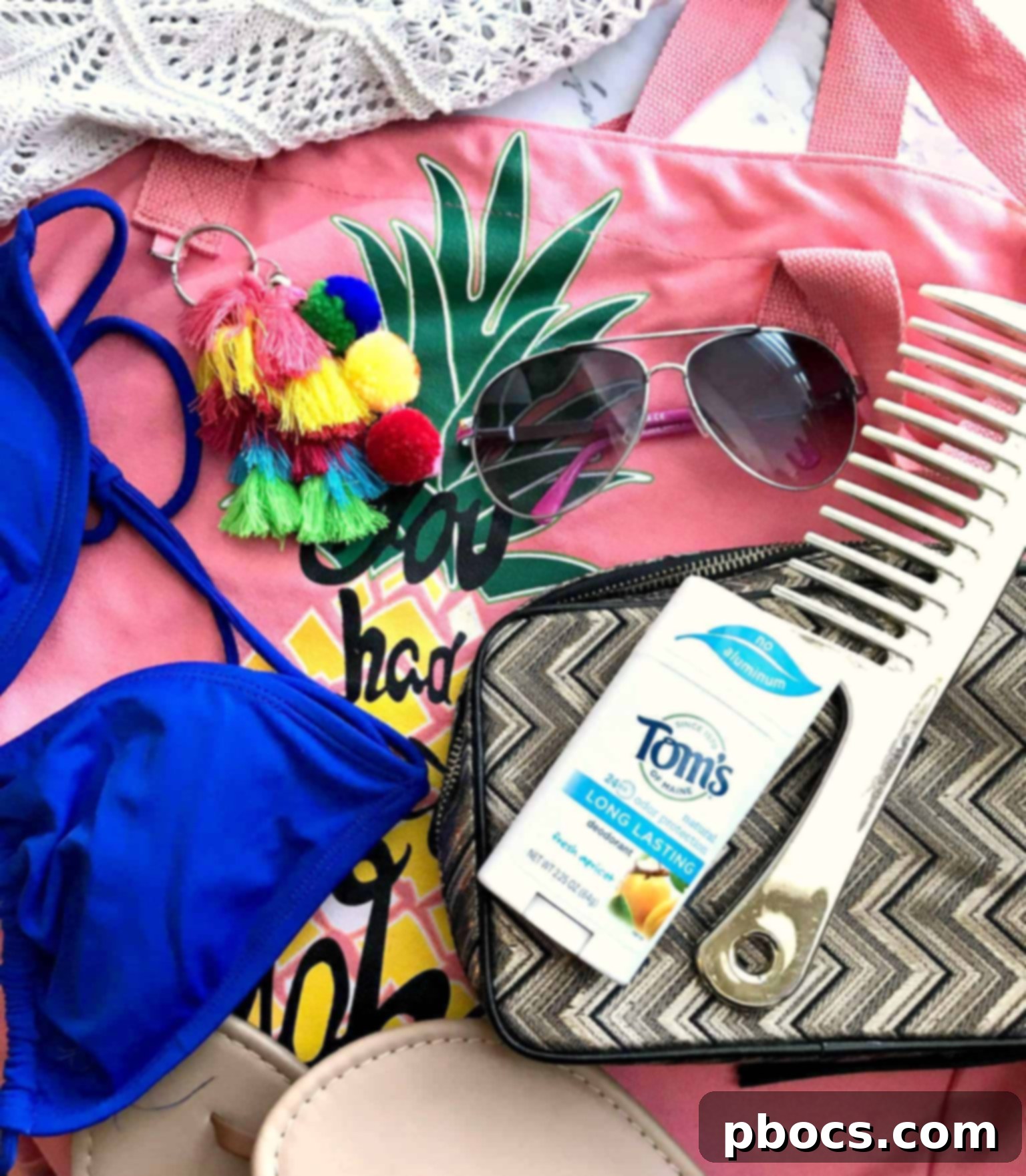 Another perspective on a neatly arranged beach bag, showcasing various personal care items and beach accessories