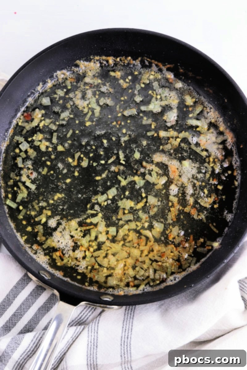 cooking onions in a skillet